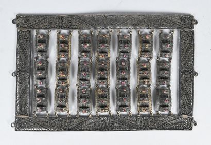 Filigree silver panel with suspended elements...
