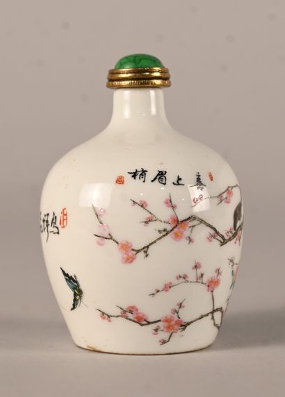 Porcelain snuff bottle decorated with prunus...
