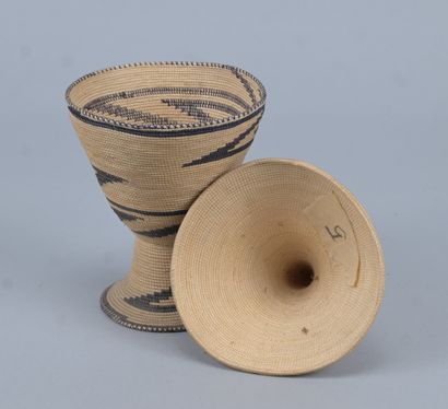 Tutsi agaseke on pedestal in woven plant...