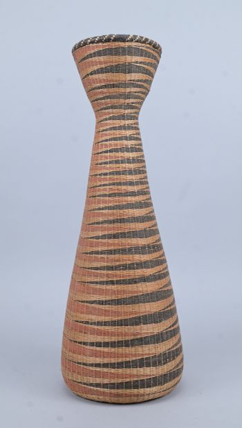 Slender Tutsi basket with geometric decoration...