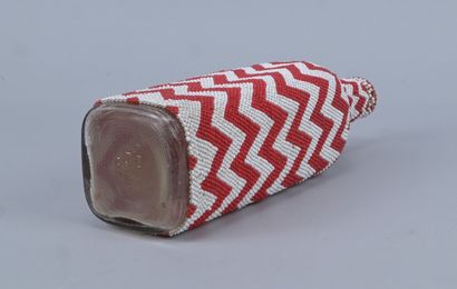 Glass bead-covered bottle with zigzag pattern...