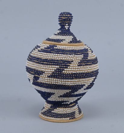 Covered Tutsi basket in raffia basketry and...