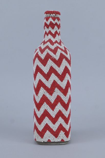 Glass bead-covered bottle with zigzag pattern...
