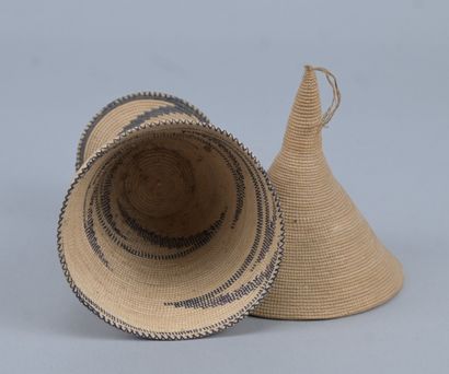 Tutsi agaseke on pedestal in woven plant...