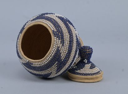 Covered Tutsi basket in raffia basketry and...