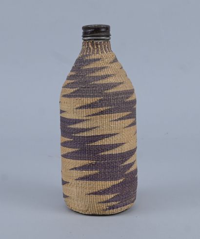 Tutsi bottle covered with wavy raffia basketry...