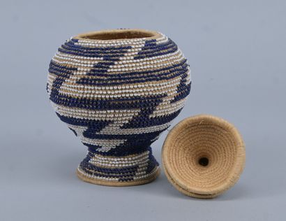 Covered Tutsi basket in raffia basketry and...