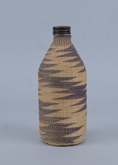 Tutsi bottle covered with wavy raffia basketry...