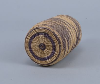 Tutsi bottle covered with wavy raffia basketry...