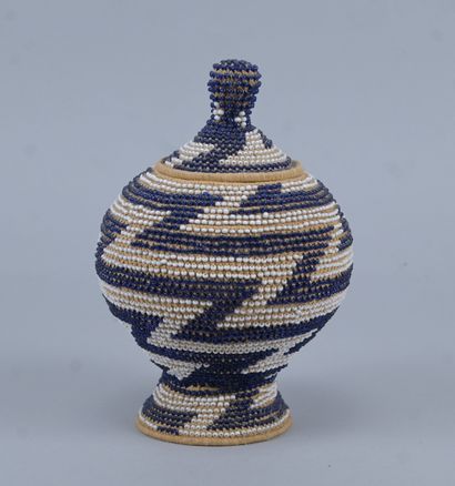 Covered Tutsi basket in raffia basketry and...