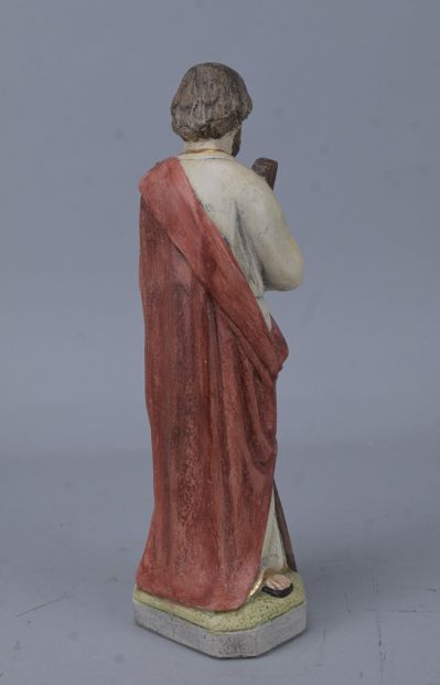Saint holding a book, religious statue in...