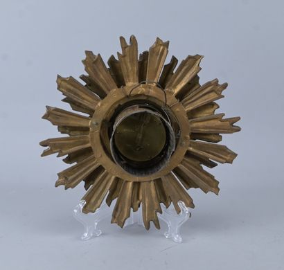 Bronze wall clock in the shape of a sun,...