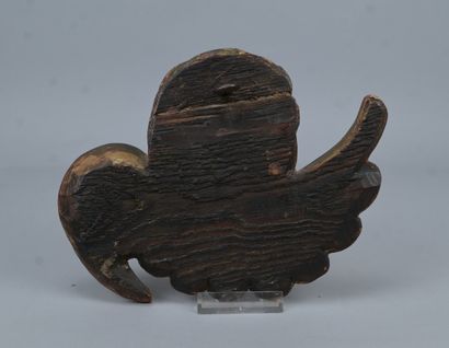 Winged angel’s head carved from softwood...