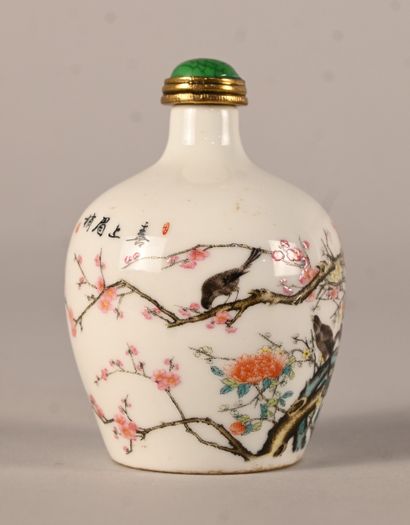 Porcelain snuff bottle decorated with prunus...