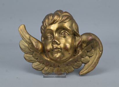Winged angel’s head carved from softwood...