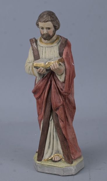 Saint holding a book, religious statue in...