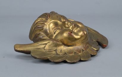 Winged angel’s head carved from softwood...