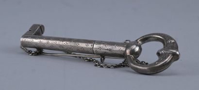 Silver needle case in the shape of a key...