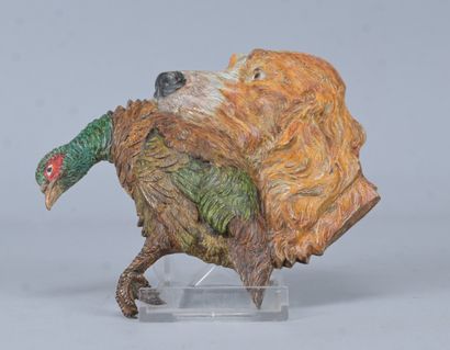 Naturalistic plaque depicting a dog's head...