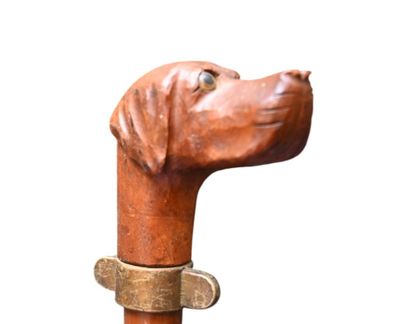 Carved wooden walking stick with dog head...