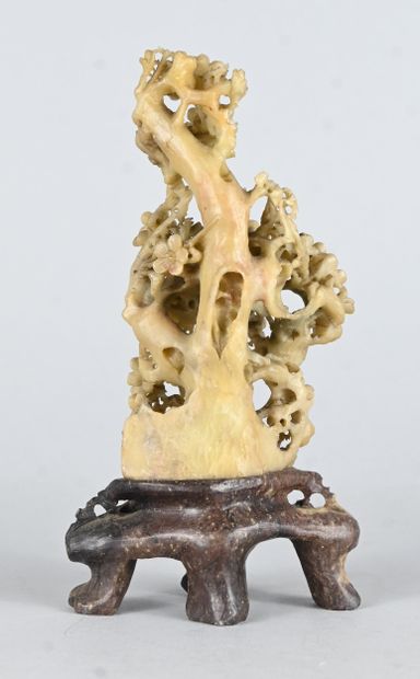 Openwork soapstone floral sculpture on base...