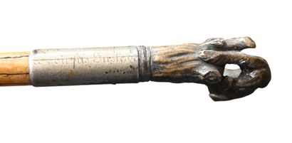 Walking stick with brass handle featuring...