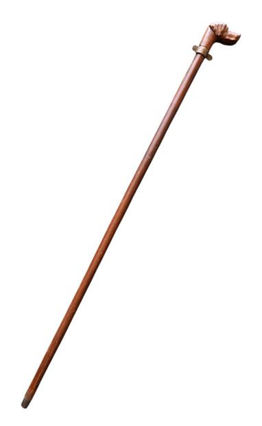 Carved wooden walking stick with dog head...
