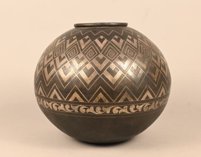 Spherical metal vase with geometric and foliate...