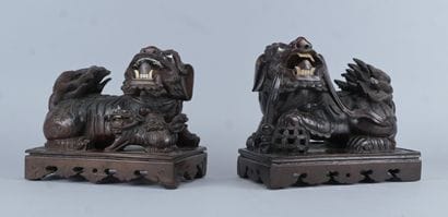 Pair of Buddhist guardian lions carved from...