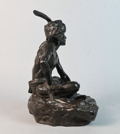 Stoneware sculpture of a seated Native American...