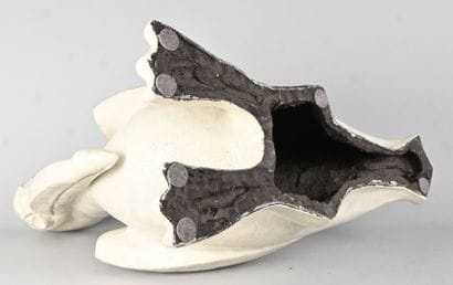Glazed stoneware animal sculpture depicting...