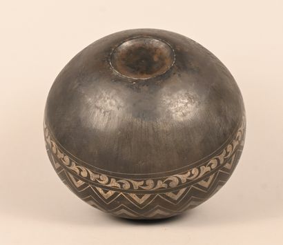 Spherical metal vase with geometric and foliate...