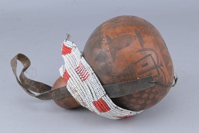 Ethiopian Gourd Engraved with Glass Beads

An...