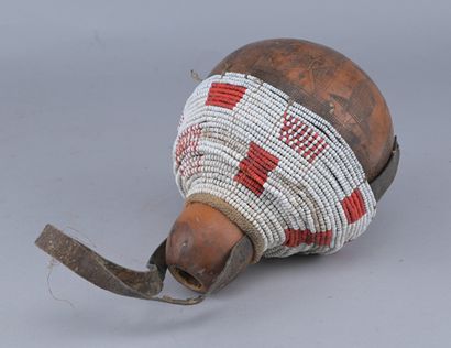 Ethiopian Gourd Engraved with Glass Beads

An...