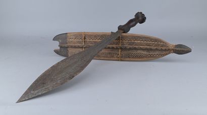 Couteau Luba avec fourreau, vers 1900

Couteau...