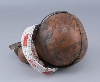 Ethiopian Gourd Engraved with Glass Beads

An...