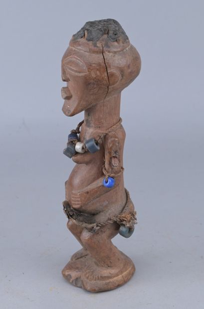 Songye Female Figure with Beads, Congo

A...