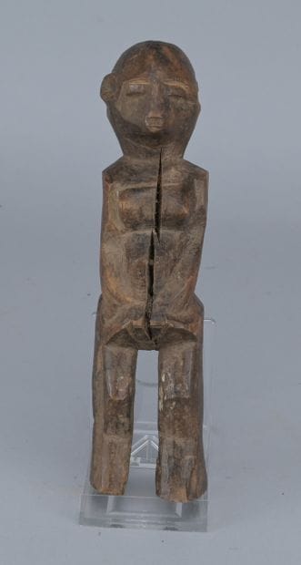 Lobi Wooden Female Figure, 20th century

A...