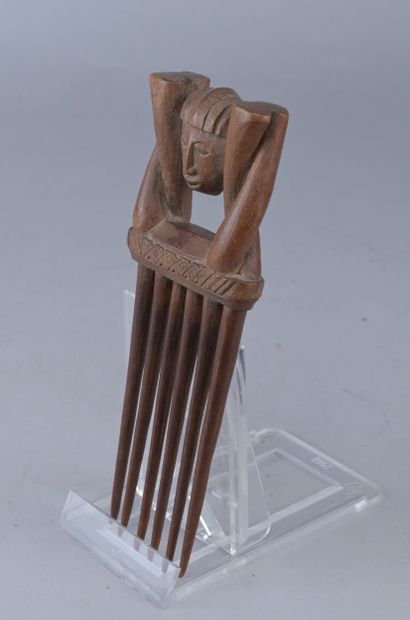 Anthropomorphic comb with janiform head -...