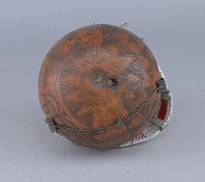 Ethiopian Gourd Engraved with Glass Beads

An...