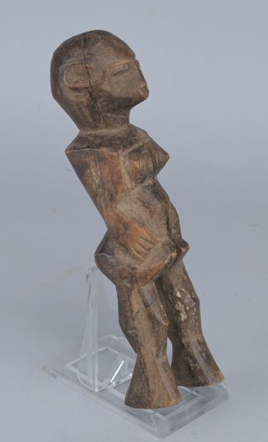 Lobi Wooden Female Figure, 20th century

A...