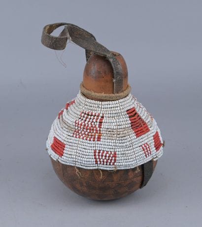 Ethiopian Gourd Engraved with Glass Beads

An...