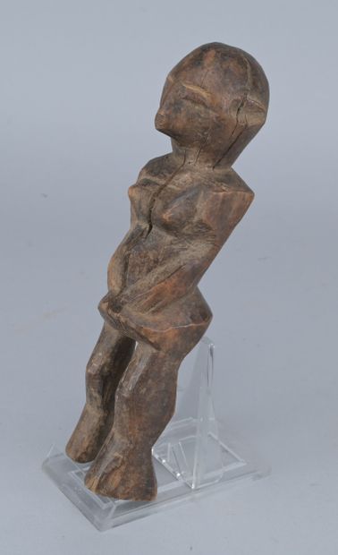 Lobi Wooden Female Figure, 20th century

A...