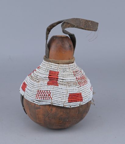 Ethiopian Gourd Engraved with Glass Beads

An...