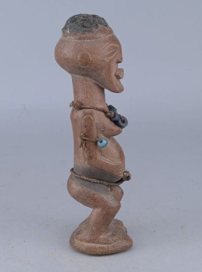 Songye Female Figure with Beads, Congo

A...