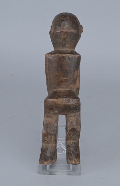 Lobi Wooden Female Figure, 20th century

A...