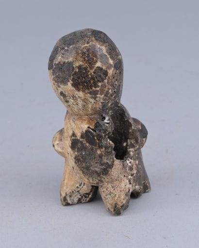 Lega Bone Statuette, Congo

A small anthropomorphic...
