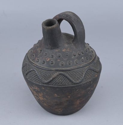 Cruche en terre cuite Kongo, début XXe siècle

Cruche...