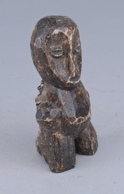 Lega Bone Statuette, Congo

A small anthropomorphic...