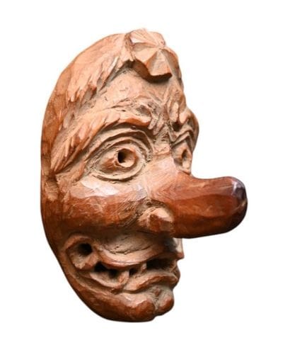 Japanese wooden Netsuke depicting a grotesque...